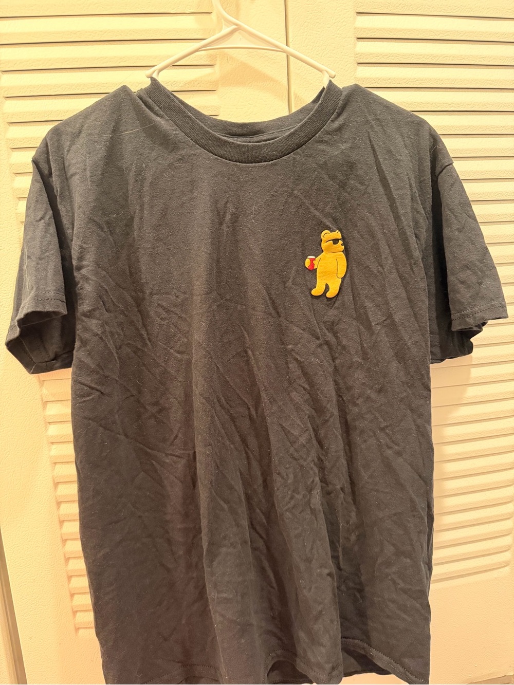 Black Graphic T‑Shirt with Bear Emblem